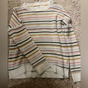 Medium off white sweater with salmon, mustard, dark gray stripes